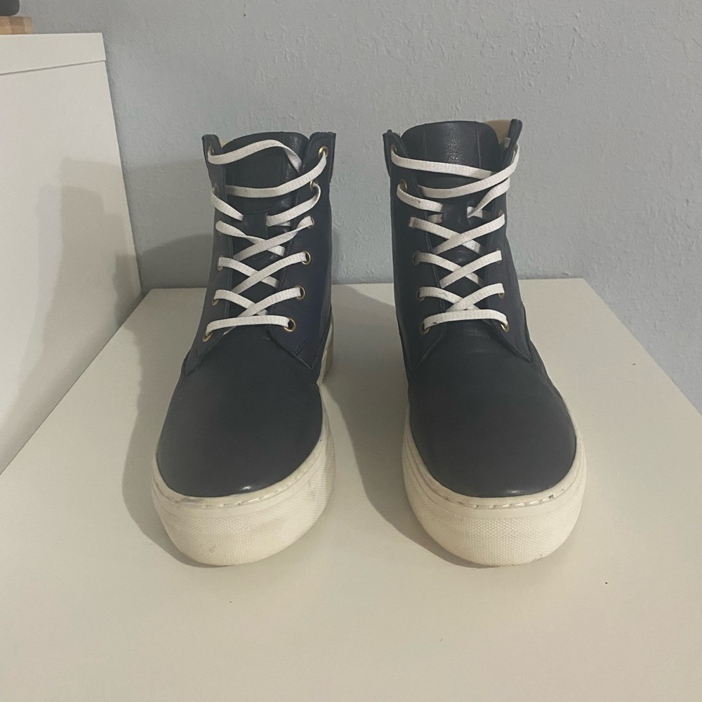 Navy blue and white high top lace up sneaker
